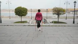 Nordic Walking Concept. Young chubby cute woman cardio training before work trying to lose weigh...