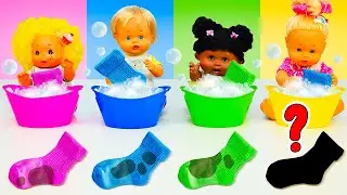 Baby dolls wash socks in colorful laundry basins. Daily routines with baby born dolls. Family videos