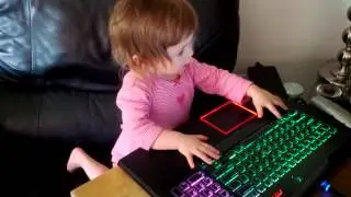 Baby playing with Alienware M17xR3