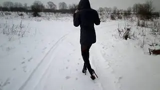 Walk on Snow in High-Heeled Boots, Feet in Pantyhose
