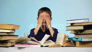 Tired Boy Takes Off and Puts on Glasses. Blue Background. Slow Motion | Stock Footage - Envato e...