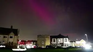 The Northern Lights dance around the skies of Northuberland above the town of Seaton Sluice