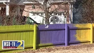 Fence fight: Woman paints fence neon colors after neighbor complains to county | WSB-TV