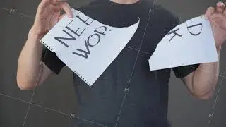 Man tearing paper with need work text