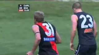 Dustin Fletcher kicks a goal from the centre square