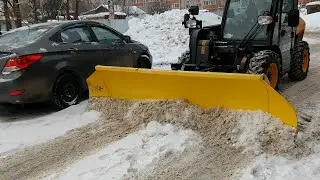 JCB telescopic loader with snow blade