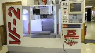 Iverson & Co. Haas VF-2 Vertical Machining Center with programmable coolant nozzle and chip auger