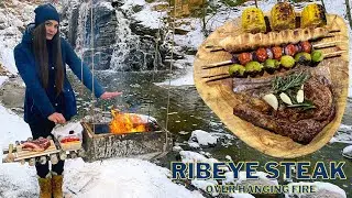 Cooking Ribeye steak on fire | DIY hanging wooden grill | Solo winter bushcraft near the waterfall