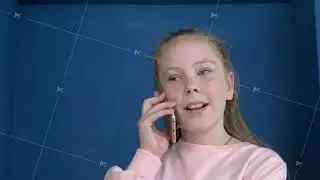 Close up view of lovely serene teen girl talking on phone