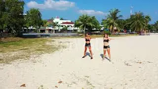 Girls best friends on tropical seashore beach trip by transparent sea with white sandy backgroun...