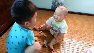 Baby joking with his brother laughing super cute