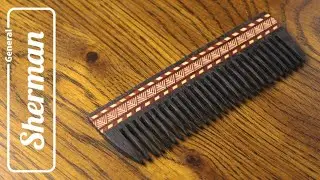 Wooden comb with inlay