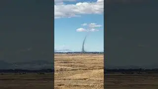 People witness a giant dust devil tornado with debris and think it was a small fire at fir