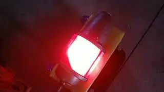 A red rotating beacon warning light