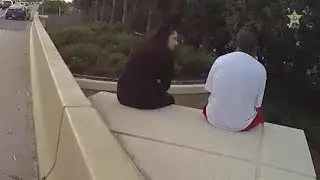 Woman uses Linkin Park lyrics to comfort man on overpass ledge