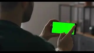 Man is surfing internet smartphone green screen