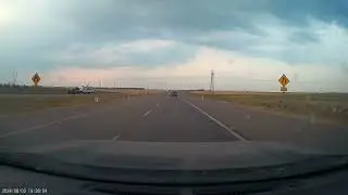 Lightning bolt strikes road close to vehicles in dash cam video from Calgary, Alberta