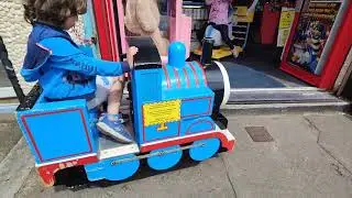 watching Thomas the tank engine kiddie ride being moved