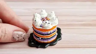 Miniature cake with eyes and ghosts for Halloween💜🖤🧡Polymer clay