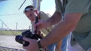 Press photographers at work setting up remote cameras for the Falcon 9 COTS-2 launch with Dragon