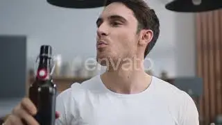Portrait of Joyful Man Opening Beer at Home Kitchen. Young Man Enjoying Alcohol | Stock Footage ...