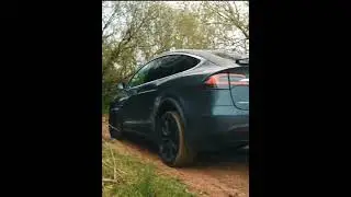 Tesla model X doing off roading in mud