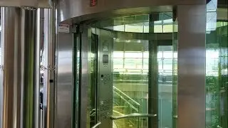 Phenomenal Cylindrical Glass Schindler M-Series Hydraulic Elevator at EuroAirport in France