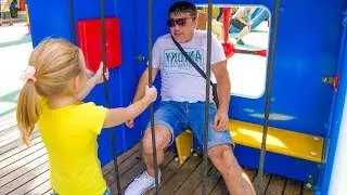 Nastya and dad play fun at the amusement park