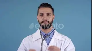 Young Male Doctor with Stethoscope Posing | Stock Footage - Envato elements
