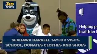 Seahawks Darrell Taylor visits Seattle school to speak with students, gift them clothes and shoes