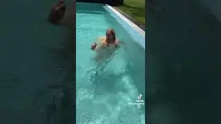 pushing her in the pool