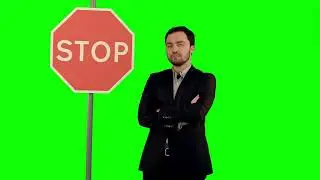 A Businessman Holding A Stop Sign On Laptop On A Green Screen Chroma Key 4k