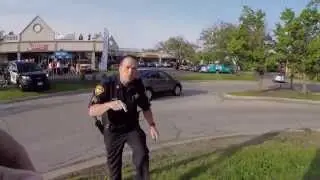 Police suppressing free speech - Get on the sidewalk! 