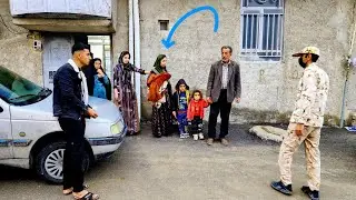 Taking Maryam out of the house in rainy weather by Abbas, Starah and her mother