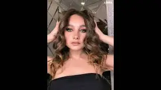 Do you like my curly hair, dark eyeliner, and black dress?