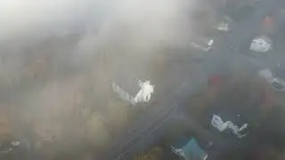 Flight above Autumn Morning Fog over Milltown