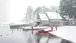 UK Snow: Kayakers head out in Keswick, Cumbria in a heavy snow blizzard.