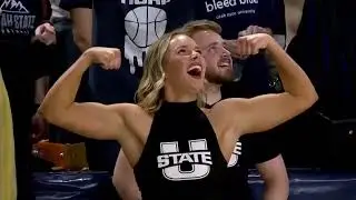 College Cheerleader Flexing her Biceps