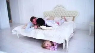 Daughter Hiding Under Bed, Mom and Dad Kiss and Looking For Kid at Home