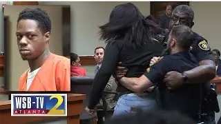 WATCH: Murder victim's teen daughter lunges at accused killer, removed from courtroom | WSB-TV