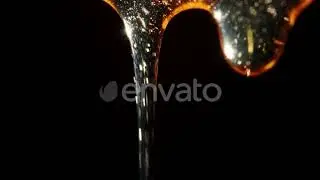 Macro Shoot of Thick Liquid Drop of Oil or Honey Falling Over Black Background | Stock Footage -...