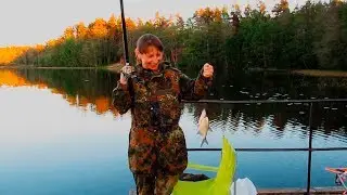 Family fishing and relaxing on Razdolinski the lake. Leningrad region.