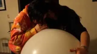 Pattie and Debbie blow a balloon!
