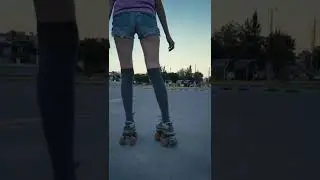 Young woman skating slowly in a parking lot, Feet of a woman on her back with skate