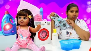 Baby dolls learn how to remove stains from dresses & wash clothes in a toy washing machine. Kids fun