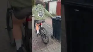 Cyclist loses control while pulling trash bin