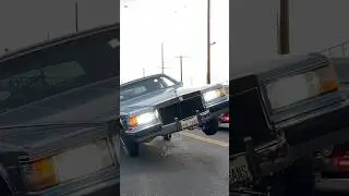Cadillac Lowrider cruising in 3 wheel motion in Los Angeles, California!