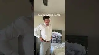 Guy is explaining why he has a wedgie in a photo from his friend's wedding!