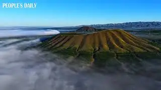 Sea of clouds is seen floating around the extinct volcanoes in Datong, N China's Shanxi