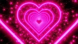 Pink Neon Heart With Star Shaped Glitter Particles on a Glittery Background. 4K Video Loop